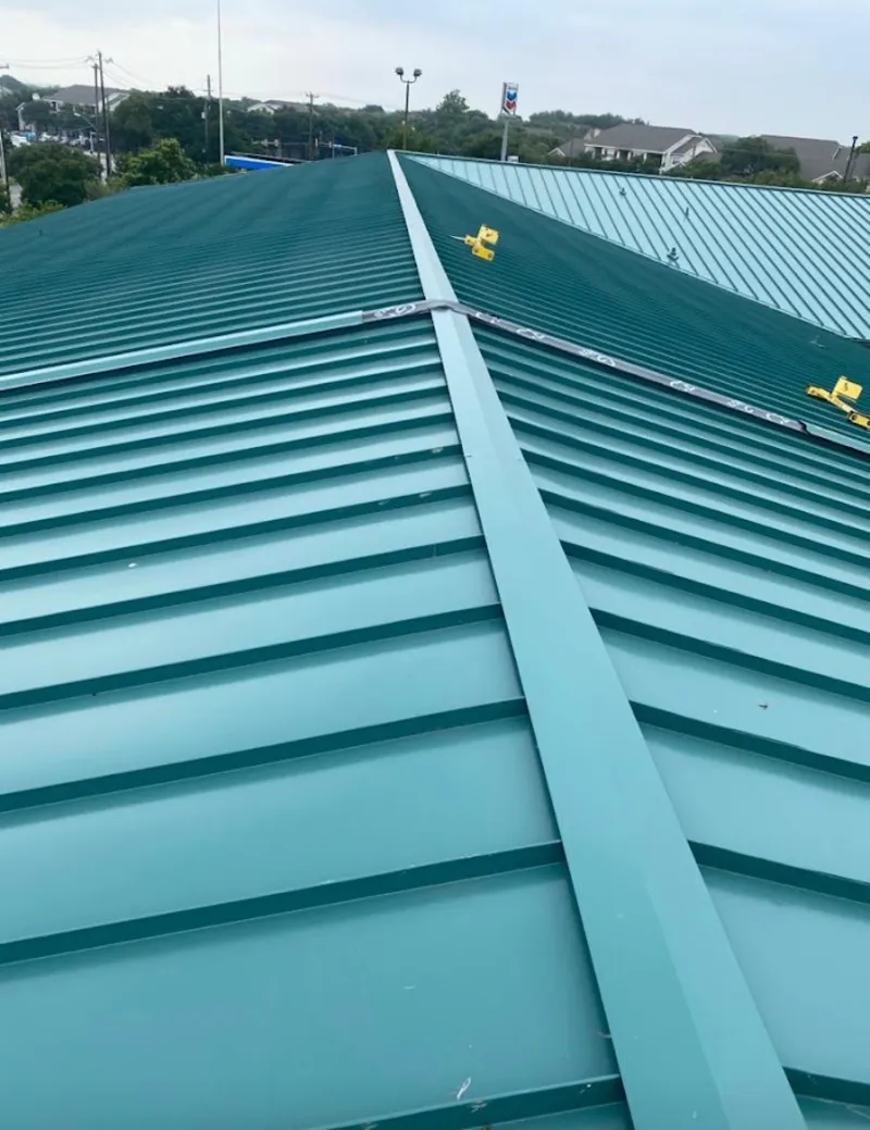 Green commercial metal roof ridge and valley for Metal Roof Repair in Sandpoint